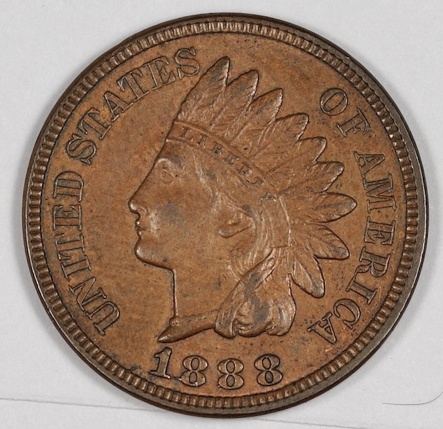 1888 Indian Head penny showing a die crack or cud error with raised line running through the coin's design
